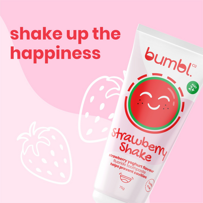 Strawberry shake graphic with strawberries behind it shake up the happiness